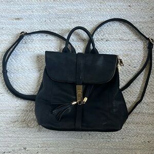 Black leather backpack pocket book. Like new condition.